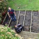 remove the existing timber decking