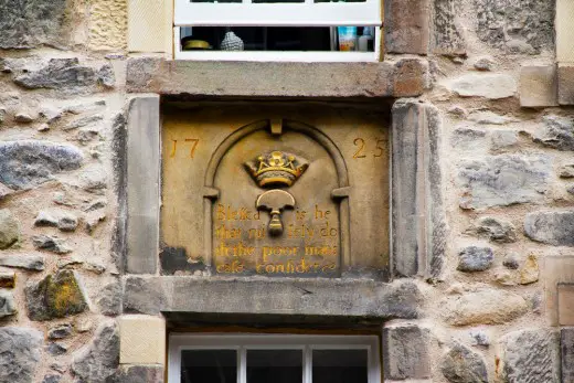 The stone cartouche on 195-197 Canongate Historic Tenements Conservation