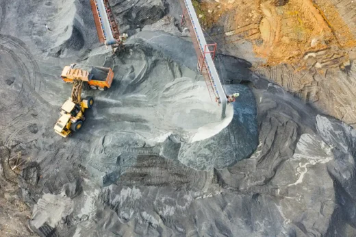 Mine trucks work mining spoil